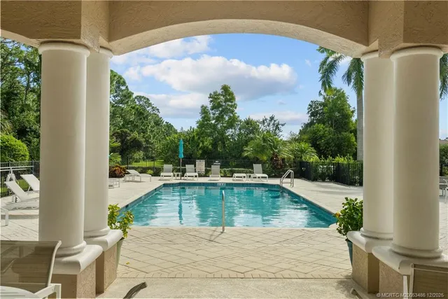 a very nice looking living room with furniture and a large window