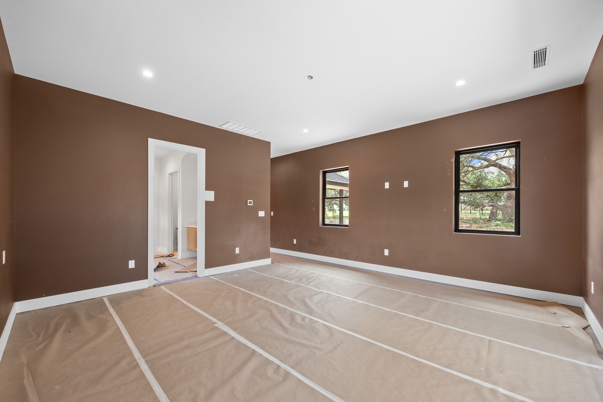903 Flint Ridge Trail Georgetown, TX 78628 - Photo 21 of 39 Spacious interior room with brown walls and white trim