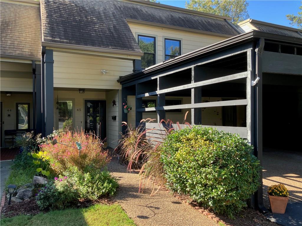 45 Forrest Place Northeast Atlanta, GA 30328 - Photo 1 of 51 a front view of a house with garden