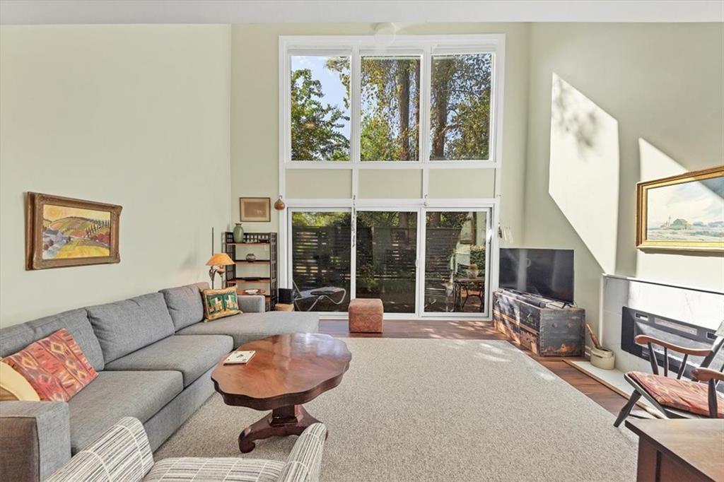 45 Forrest Place Northeast Atlanta, GA 30328 - Photo 11 of 51 a living room with furniture and a large window