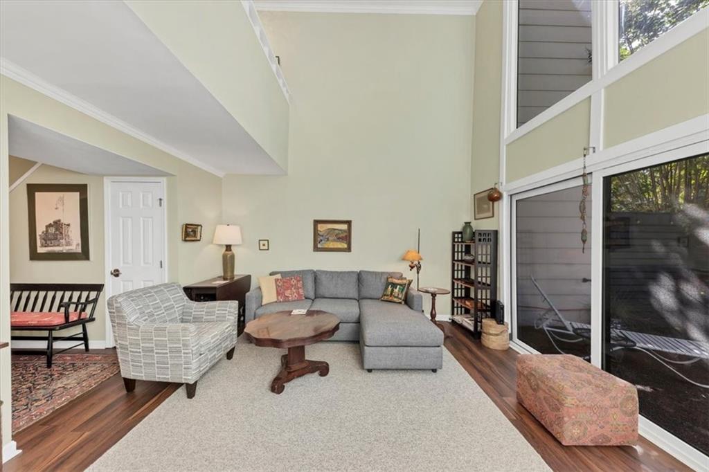 45 Forrest Place Northeast Atlanta, GA 30328 - Photo 12 of 51 a living room with furniture and a flat screen tv