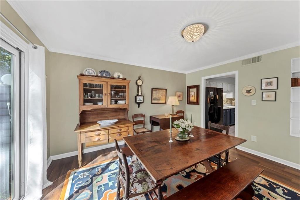 45 Forrest Place Northeast Atlanta, GA 30328 - Photo 16 of 51 a view of a dining room with furniture and wooden floor