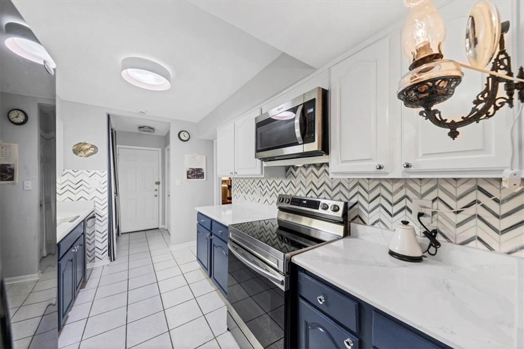 45 Forrest Place Northeast Atlanta, GA 30328 - Photo 18 of 51 a kitchen that has a sink and a stove