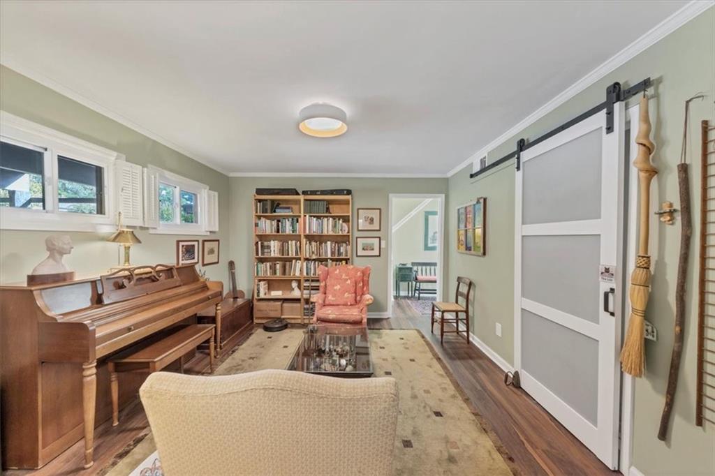 45 Forrest Place Northeast Atlanta, GA 30328 - Photo 23 of 51 a living room with furniture fireplace and a wooden floor