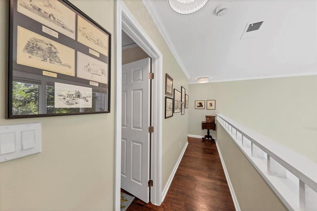 45 Forrest Place Northeast Atlanta, GA 30328 - Photo 24 of 51 a view of a hallway with wooden floor and staircase
