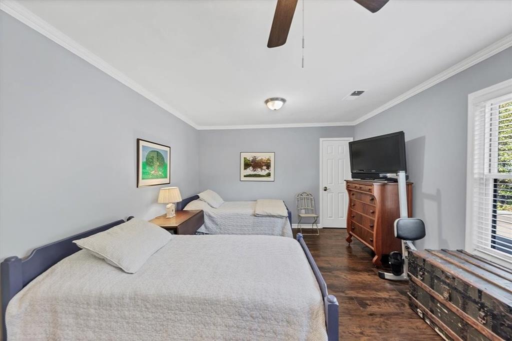 45 Forrest Place Northeast Atlanta, GA 30328 - Photo 26 of 51 a bedroom with a bed and flat screen tv