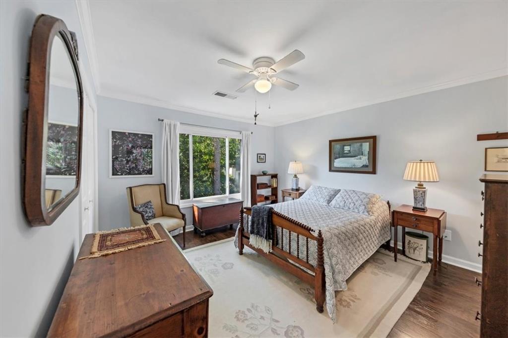 45 Forrest Place Northeast Atlanta, GA 30328 - Photo 30 of 51 a bed room with a bed and a chandelier