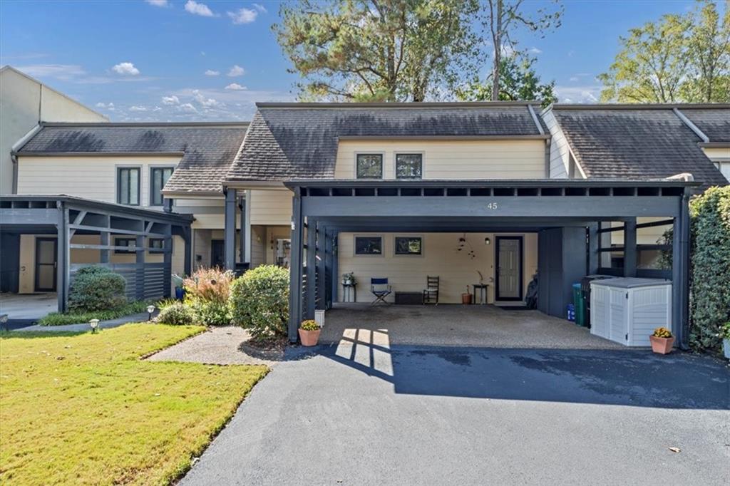 45 Forrest Place Northeast Atlanta, GA 30328 - Photo 3 of 51 a front view of a house with yard outdoor seating and barbeque oven