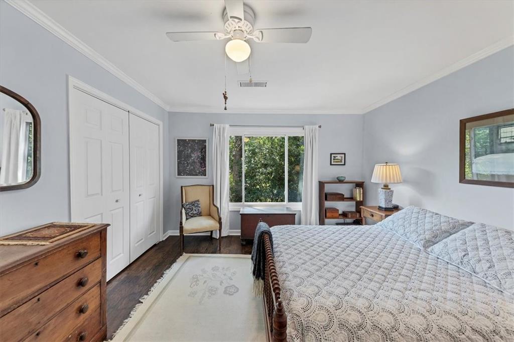 45 Forrest Place Northeast Atlanta, GA 30328 - Photo 31 of 51 a bed room with a bed window and a chandelier