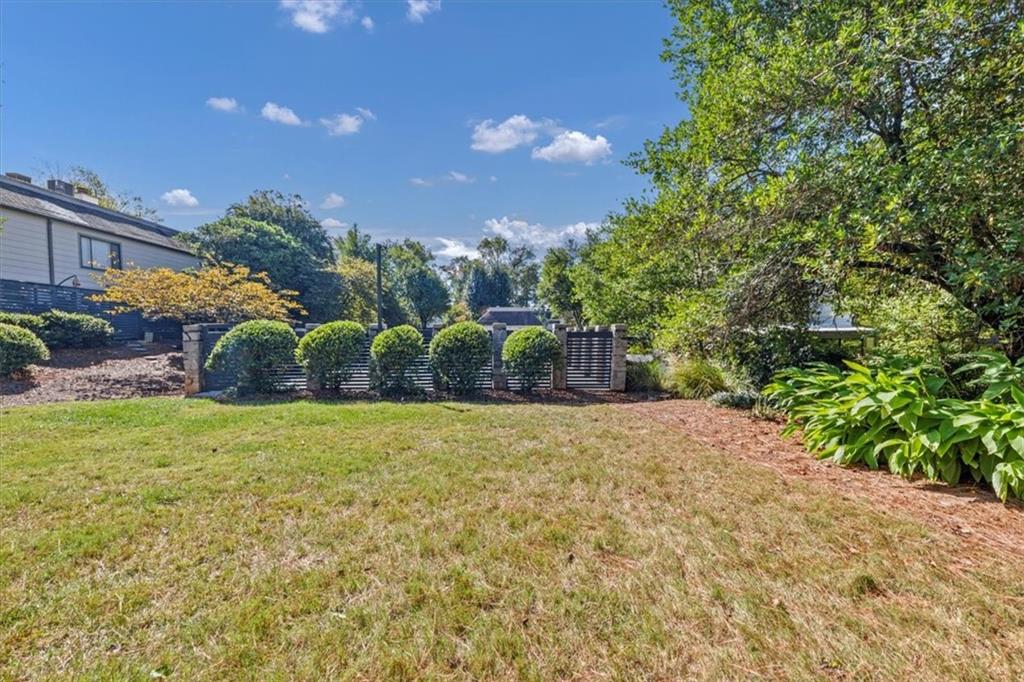 45 Forrest Place Northeast Atlanta, GA 30328 - Photo 39 of 51 a backyard of a house with lots of green space