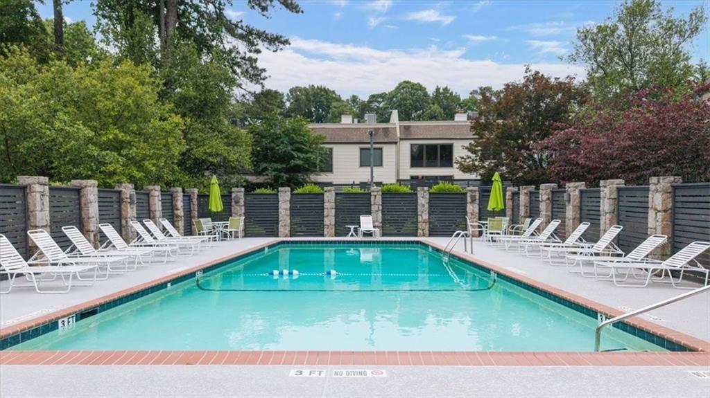 45 Forrest Place Northeast Atlanta, GA 30328 - Photo 41 of 51 a view of a house with swimming pool