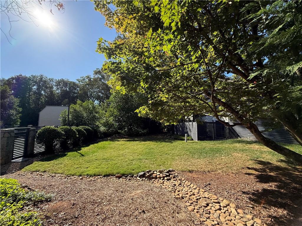 45 Forrest Place Northeast Atlanta, GA 30328 - Photo 42 of 51 a view of a garden with large trees
