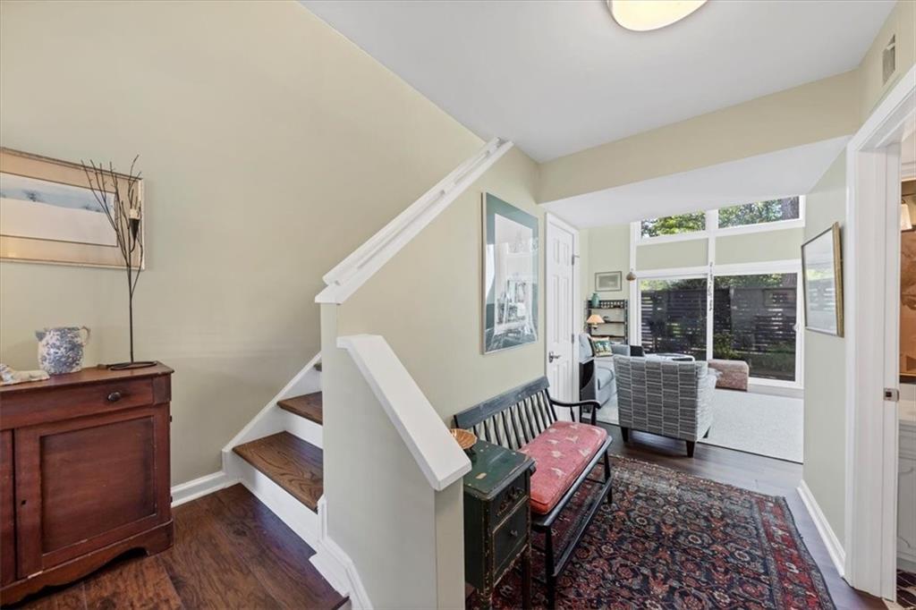 45 Forrest Place Northeast Atlanta, GA 30328 - Photo 6 of 51 a living room with furniture and wooden floor