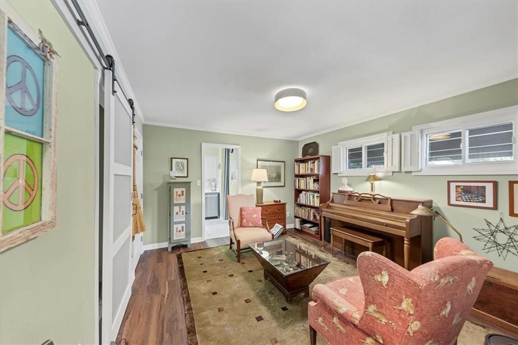 45 Forrest Place Northeast Atlanta, GA 30328 - Photo 7 of 51 a living room with furniture and a flat screen tv