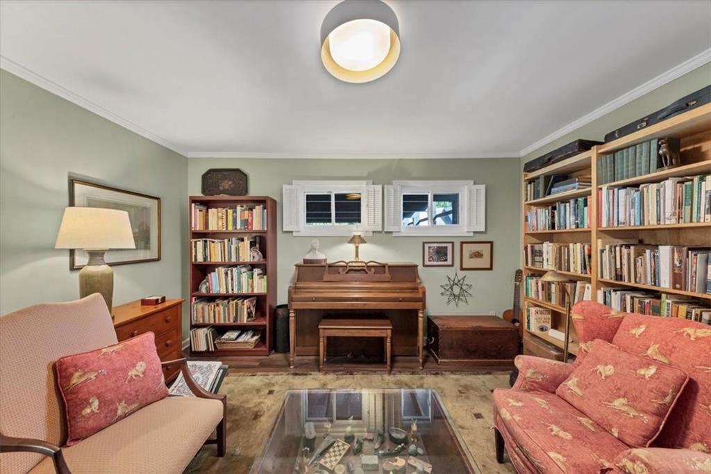 45 Forrest Place Northeast Atlanta, GA 30328 - Photo 8 of 51 a living room with a couch and a book shelf