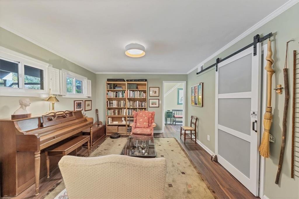 45 Forrest Place Northeast Atlanta, GA 30328 - Photo 9 of 51 a living room with furniture fireplace and a wooden floor