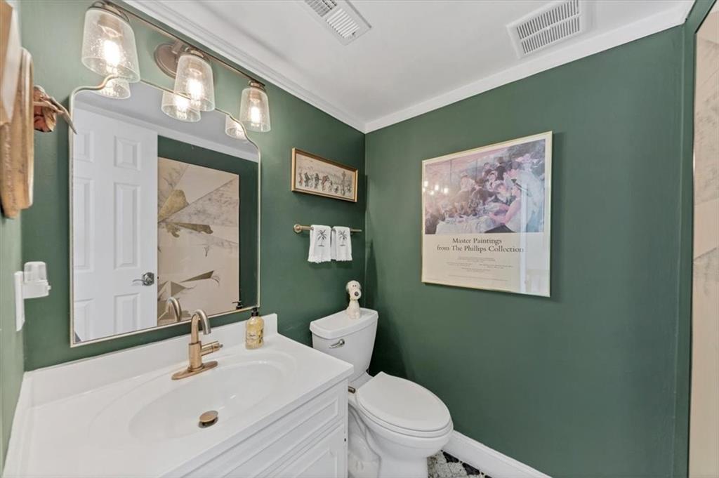 45 Forrest Place Northeast Atlanta, GA 30328 - Photo 10 of 51 a bathroom with a toilet sink and mirror