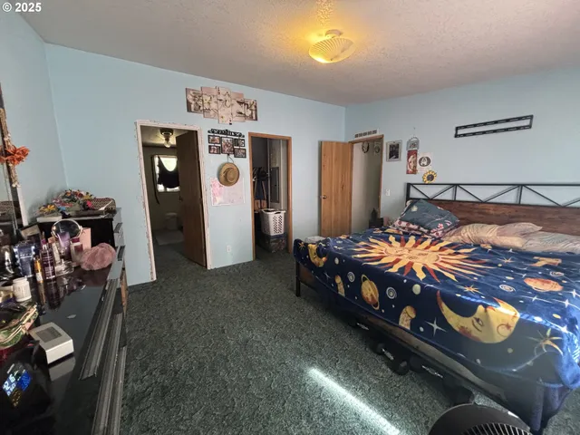 a bedroom with bed and window