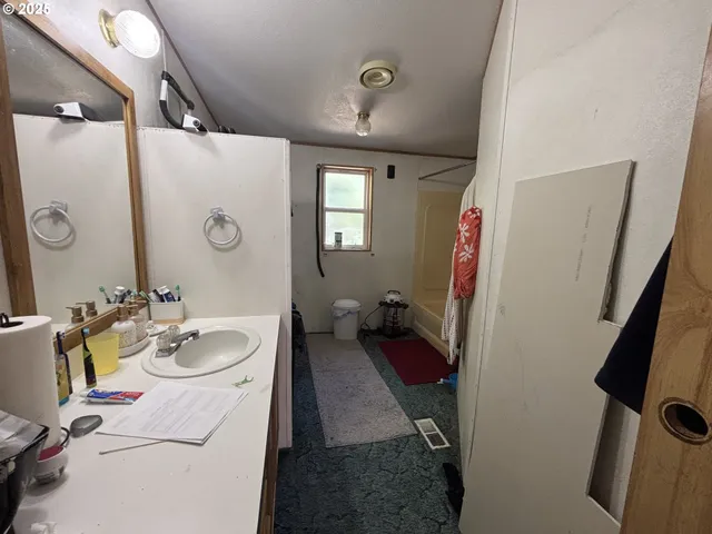a bathroom with a sink double vanity and mirror