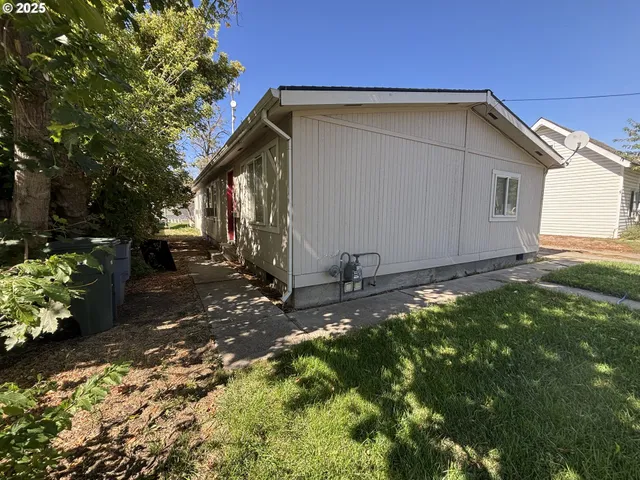 a backyard of a house with lots of green space