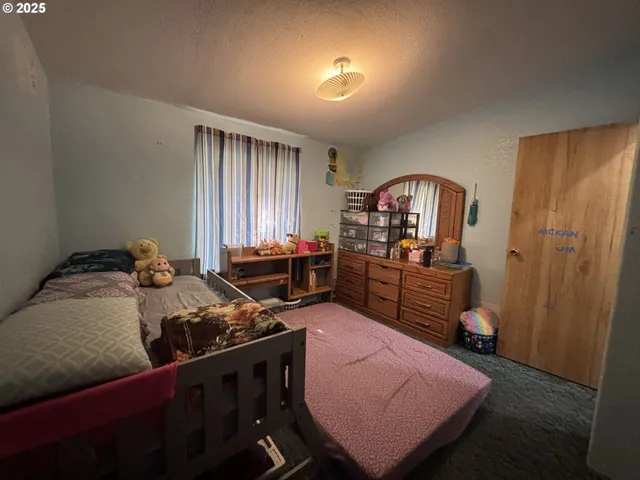 a bed room with furniture and a window