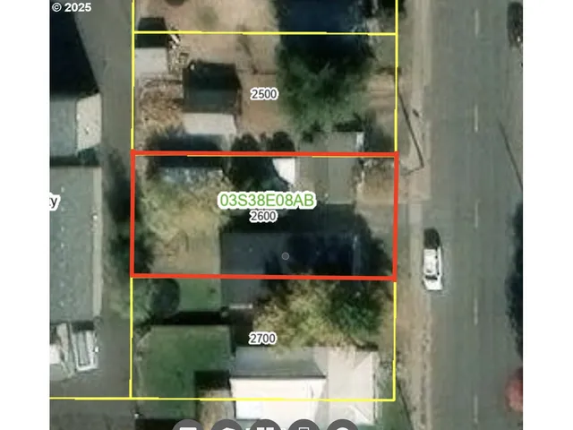 a bathroom with a small yard and large mirror