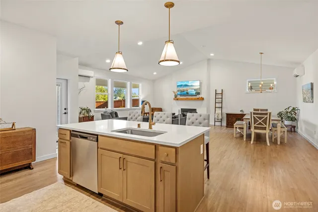a view of a kitchen counter space dining table and chairs