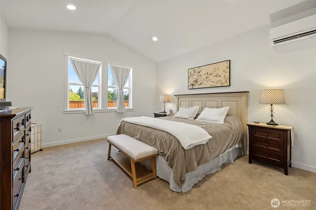 a bedroom with a bed and a night stand