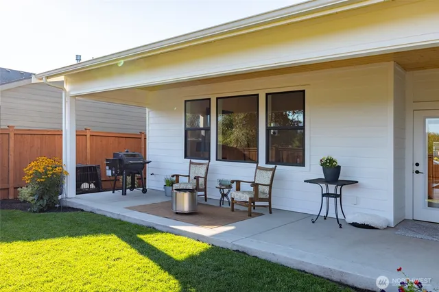 a swimming pool with outdoor seating view and a garden