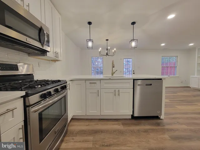 a kitchen with a stove and a microwave