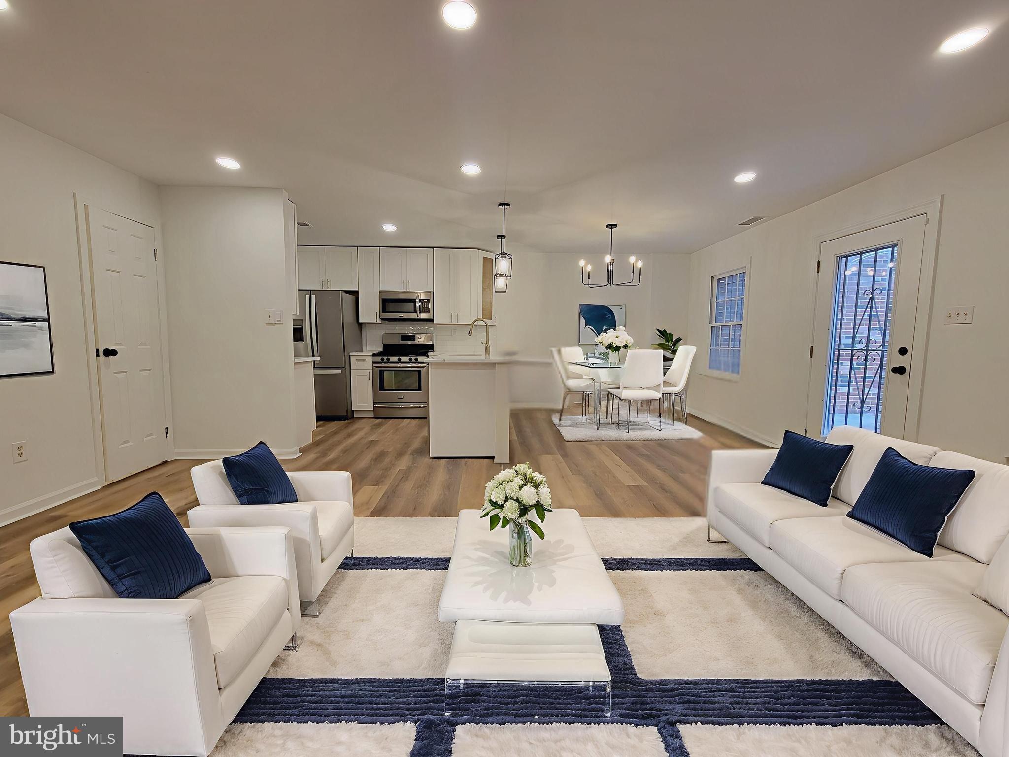 1727 Fitzwater Street, Unit B Philadelphia, PA 19146 - Photo 2 of 31 a living room with furniture or couch and a coffee table