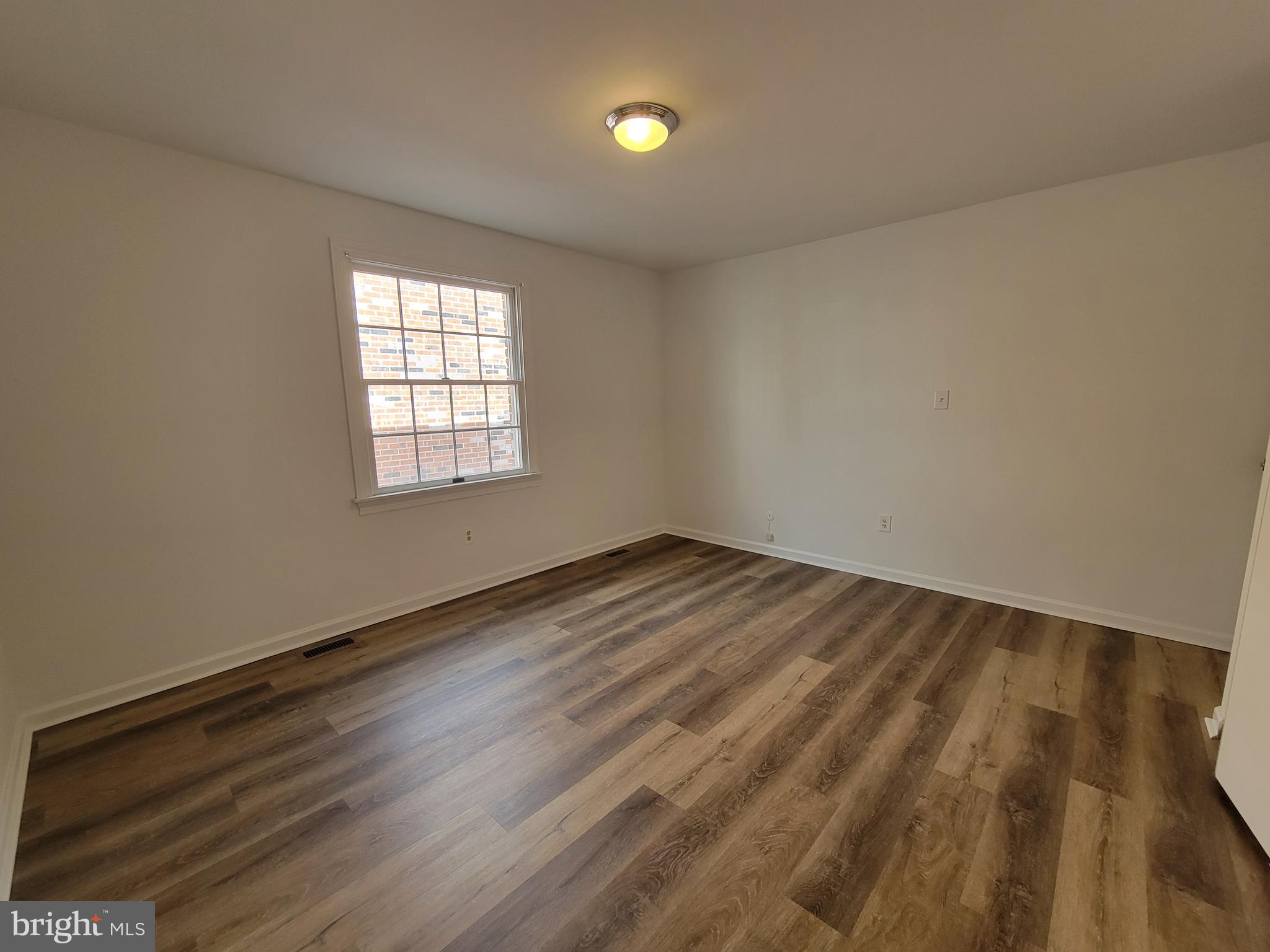 1727 Fitzwater Street, Unit B Philadelphia, PA 19146 - Photo 23 of 31 a view of empty room with wooden floor and fan