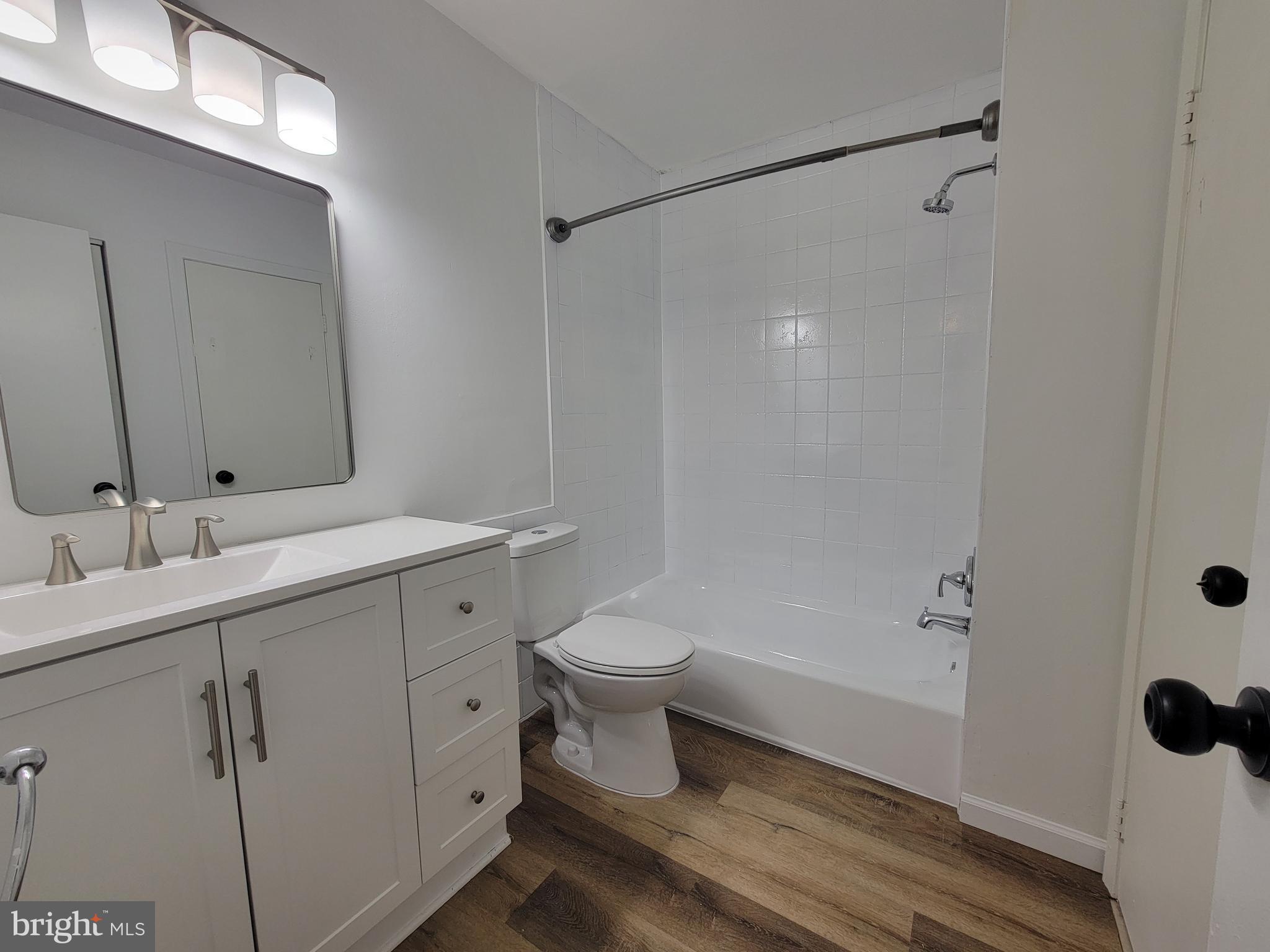 1727 Fitzwater Street, Unit B Philadelphia, PA 19146 - Photo 25 of 31 a bathroom with a sink a toilet and shower