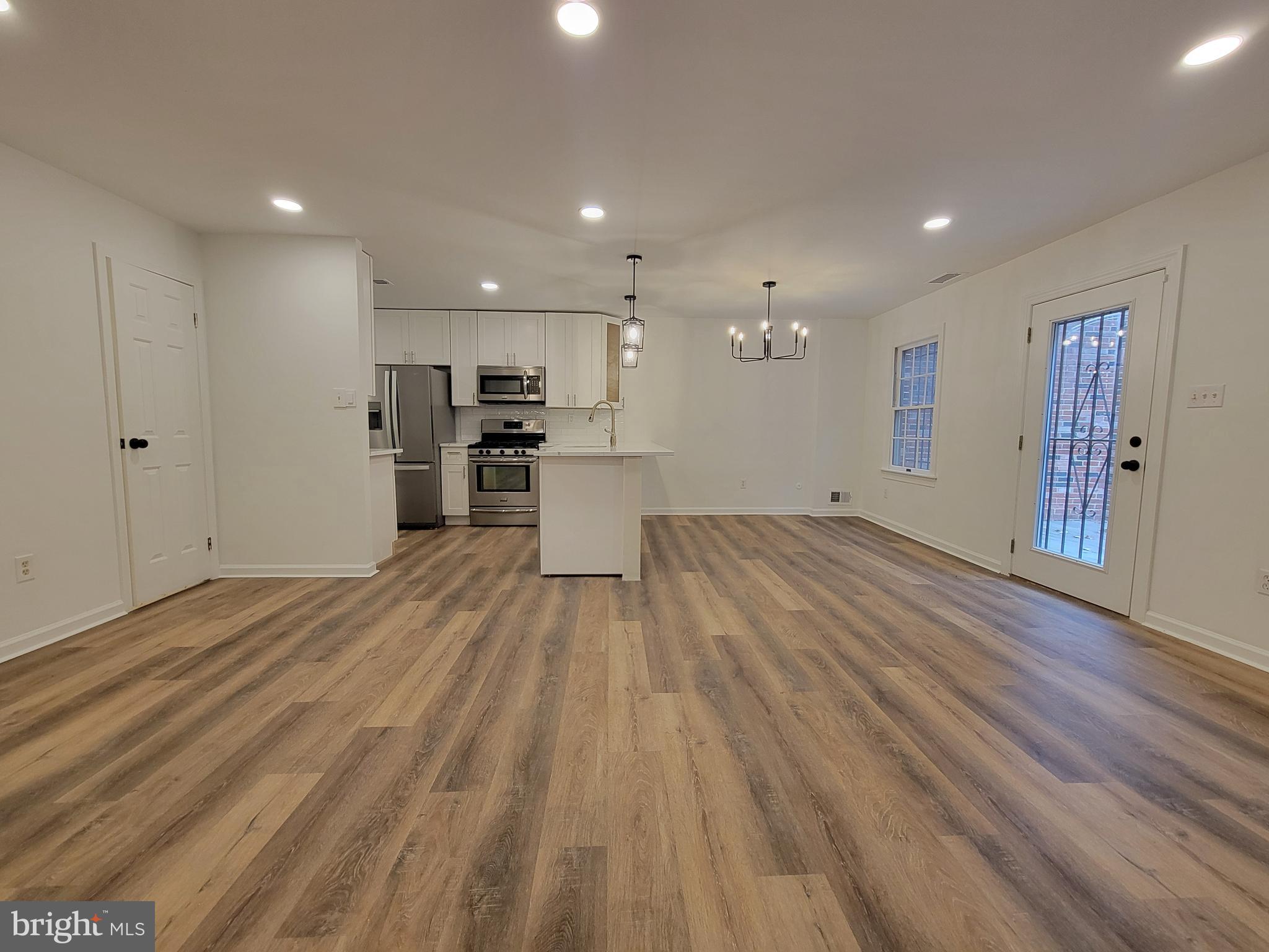 1727 Fitzwater Street, Unit B Philadelphia, PA 19146 - Photo 6 of 31 a view of a kitchen with a sink and a refrigerator