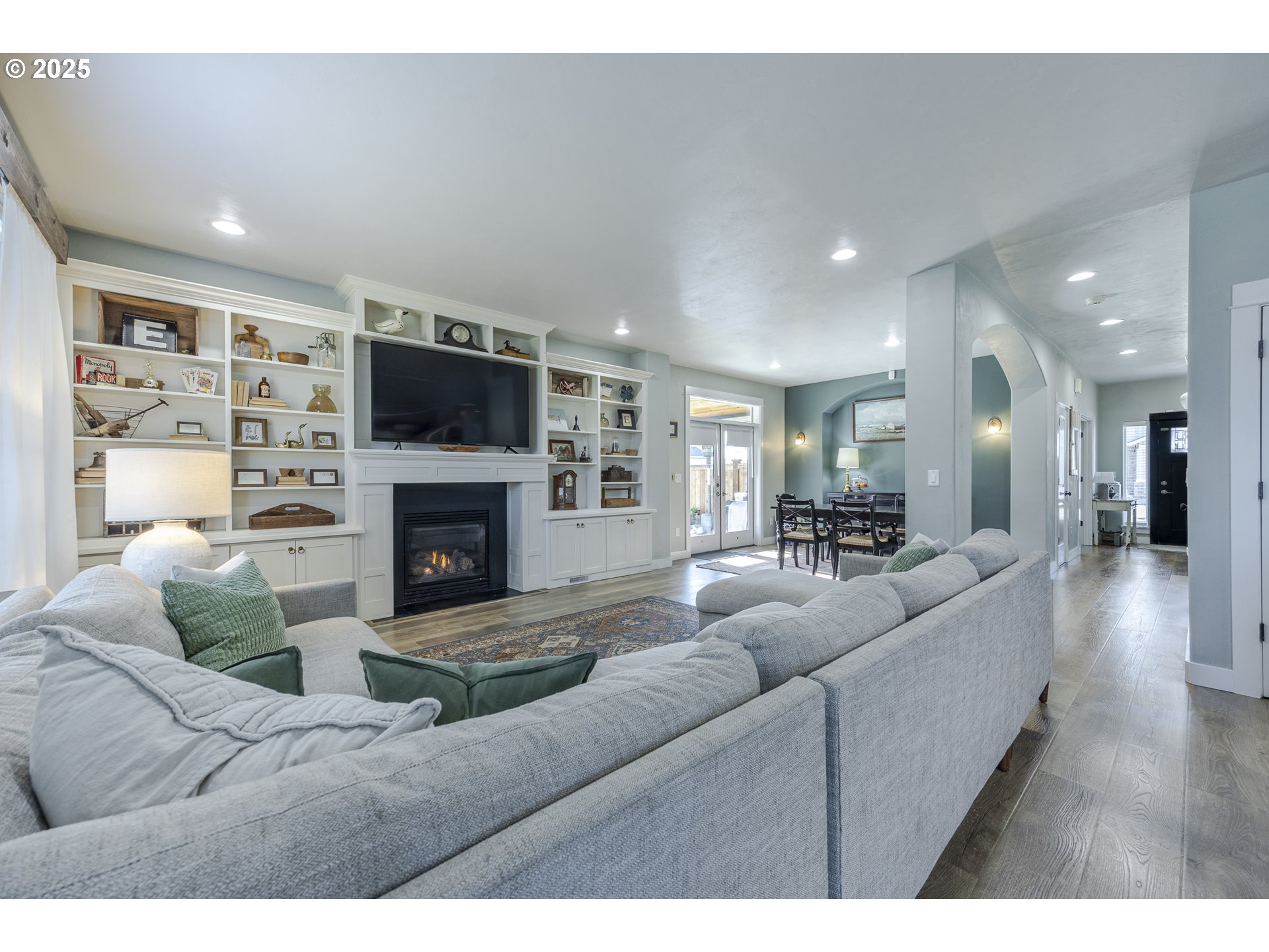 2409 Crowther Drive Eugene, OR 97404 - Photo 15 of 48 a living room with furniture a flat screen tv and a fireplace