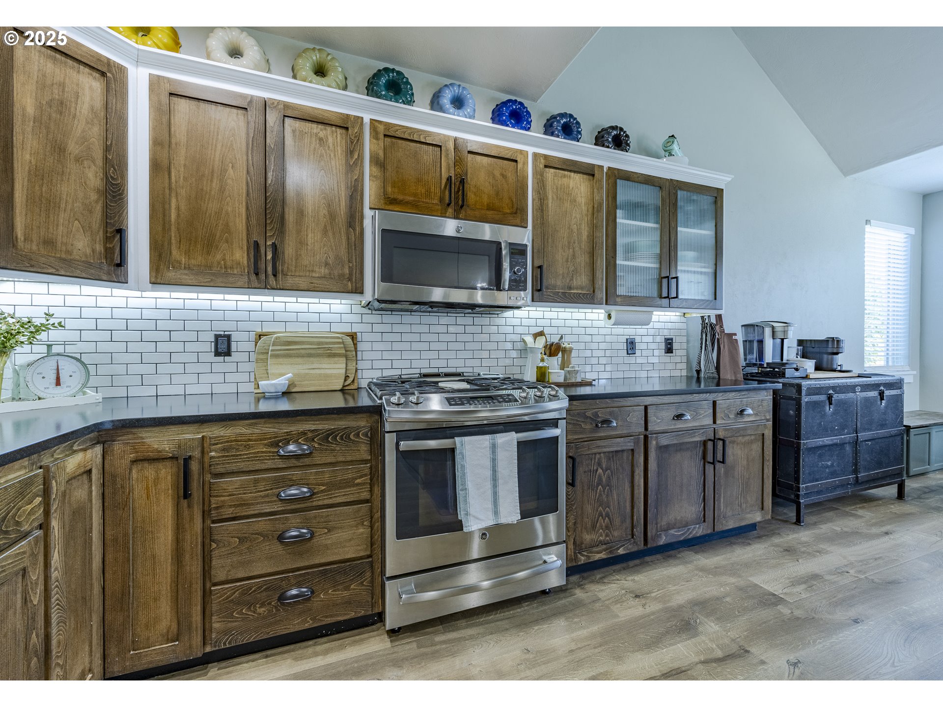 2409 Crowther Drive Eugene, OR 97404 - Photo 18 of 48 a kitchen with stainless steel appliances granite countertop a sink and a stove