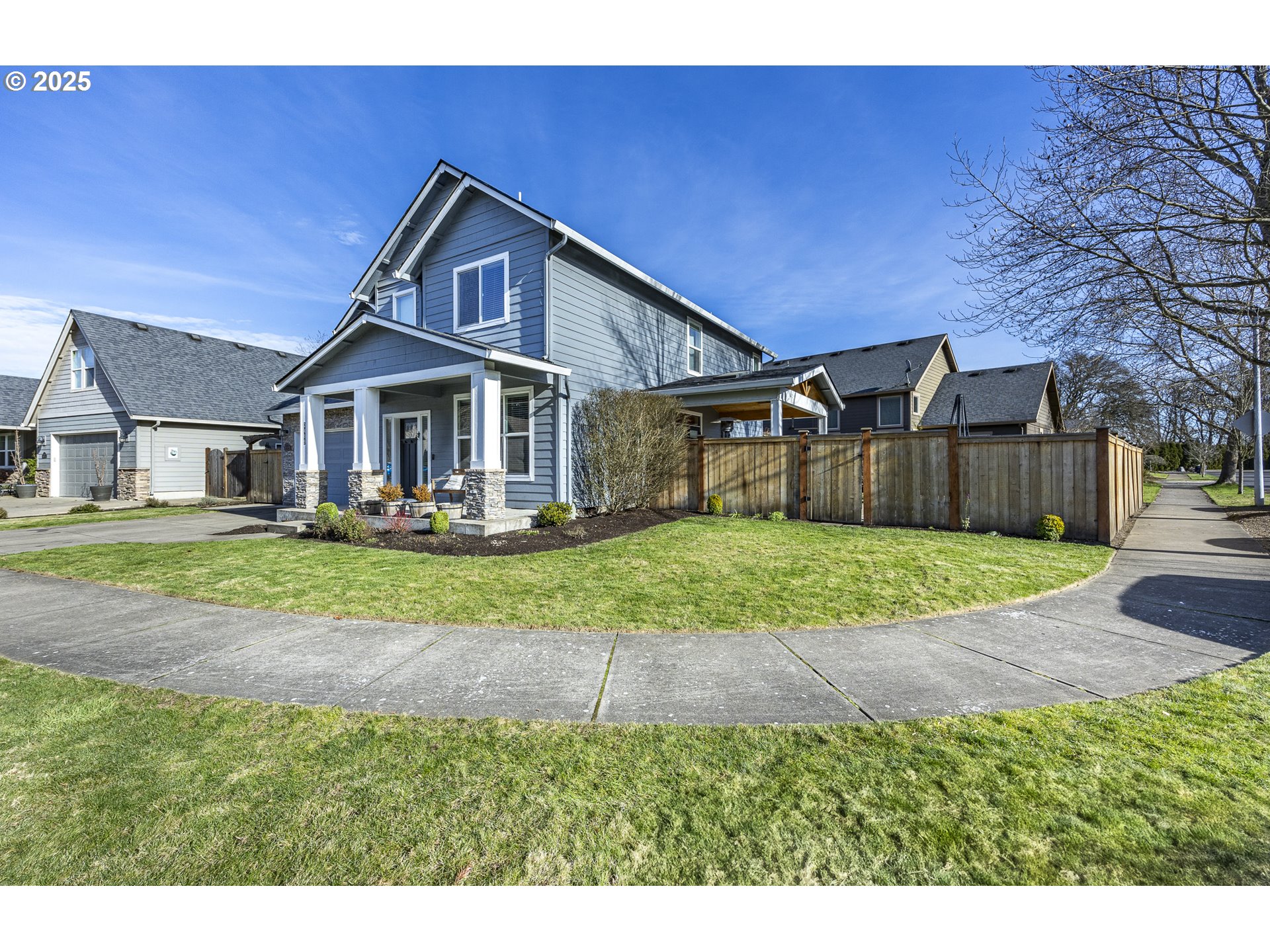 2409 Crowther Drive Eugene, OR 97404 - Photo 2 of 48 a front view of a house with a yard and garage