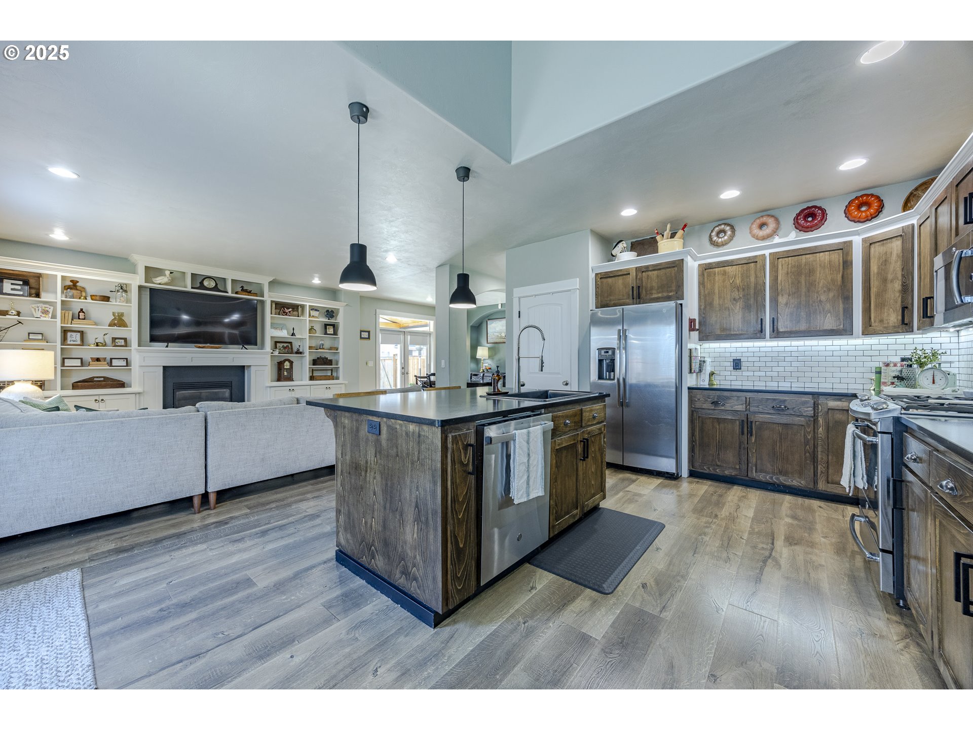 2409 Crowther Drive Eugene, OR 97404 - Photo 22 of 48 a kitchen with stainless steel appliances granite countertop a stove and a sink