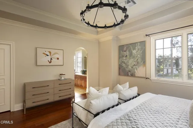 a bedroom with furniture and window