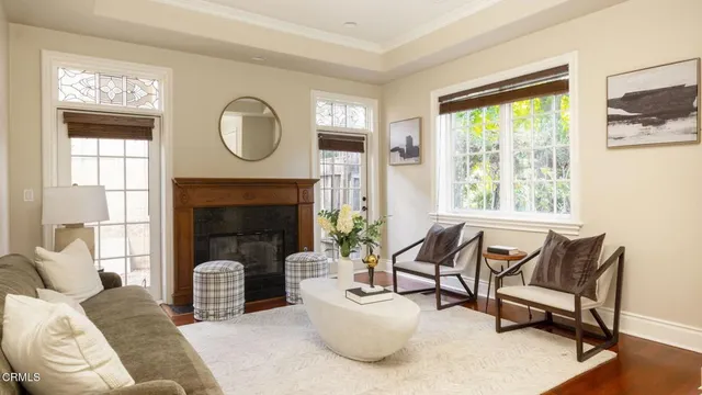 a living room with furniture and a fireplace