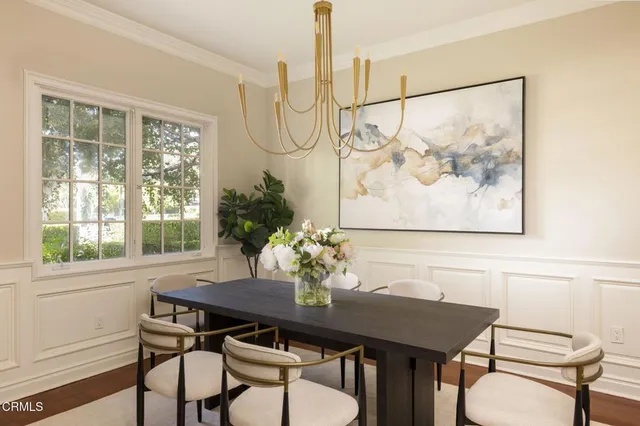 a view of a dining room with furniture window and outside view