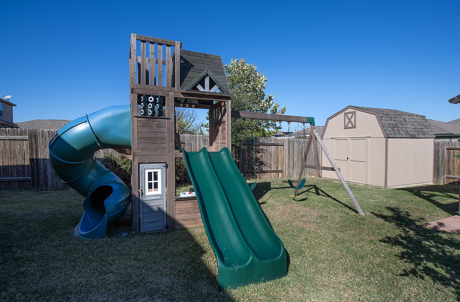 216 Millers Loop Jarrell, TX 76537 - Photo 27 of 31 View of jungle gym with a fenced backyard and a storage shed