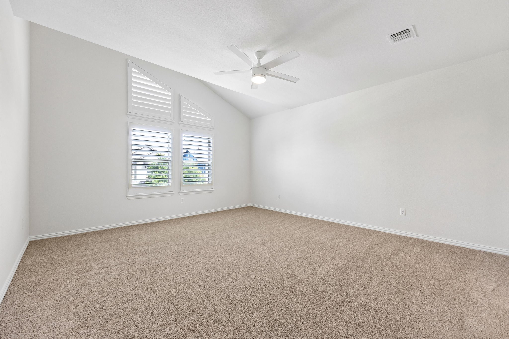 8816 Cattle Baron Path Austin, TX 78747 - Photo 15 of 32 an empty room with windows and ceiling fan