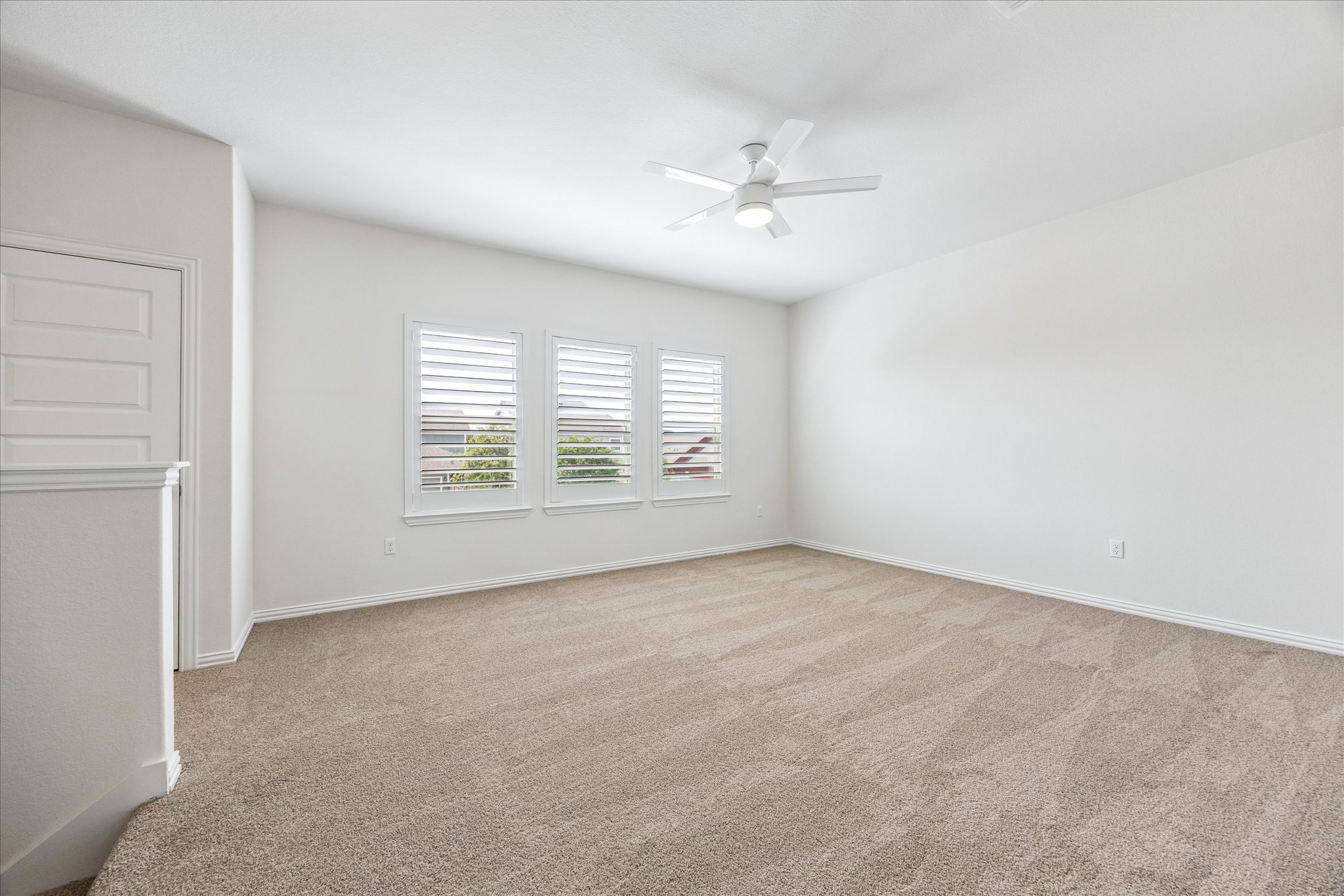 8816 Cattle Baron Path Austin, TX 78747 - Photo 20 of 32 an empty room with windows and fan