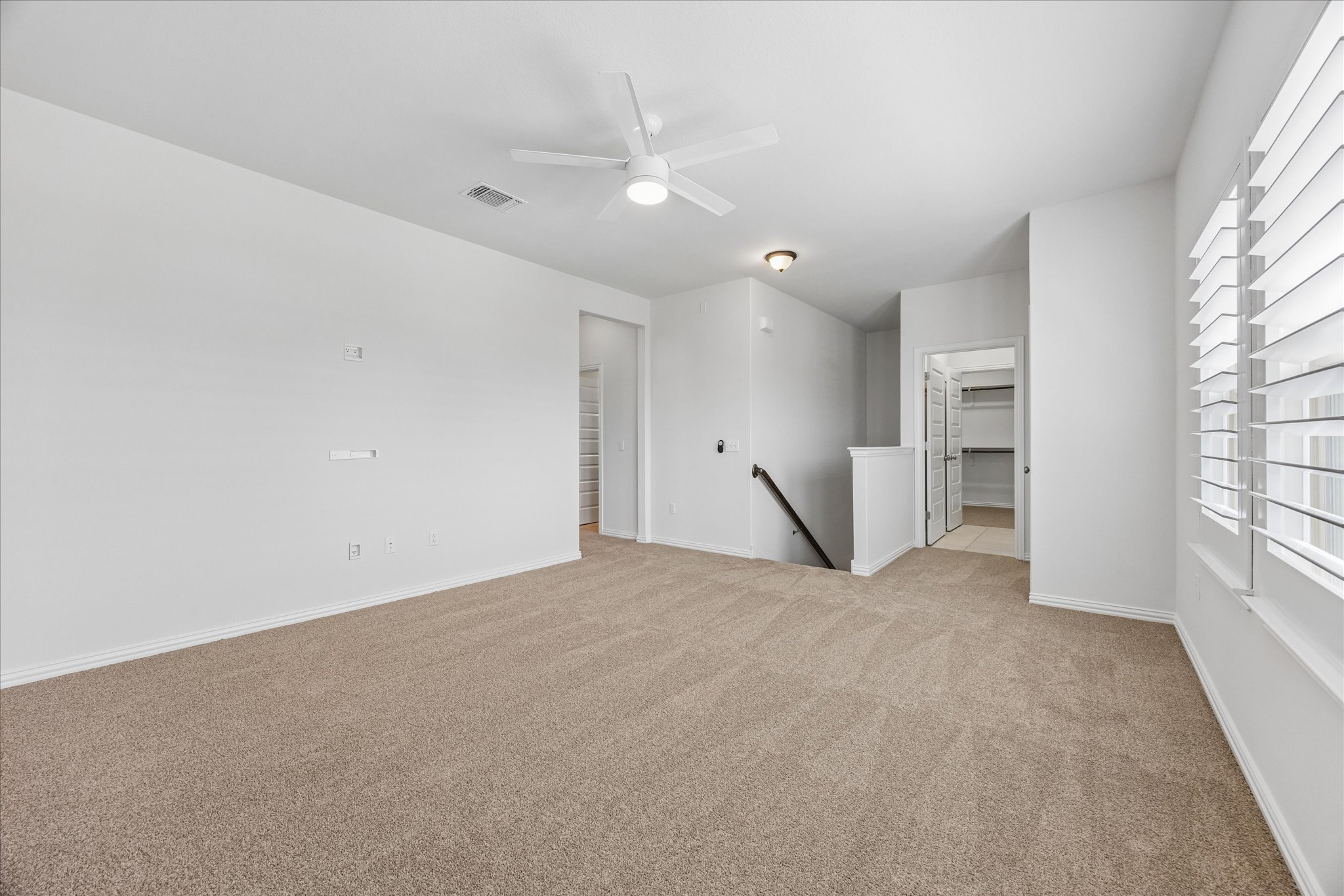 8816 Cattle Baron Path Austin, TX 78747 - Photo 21 of 32 wooden floor in an empty room with a window