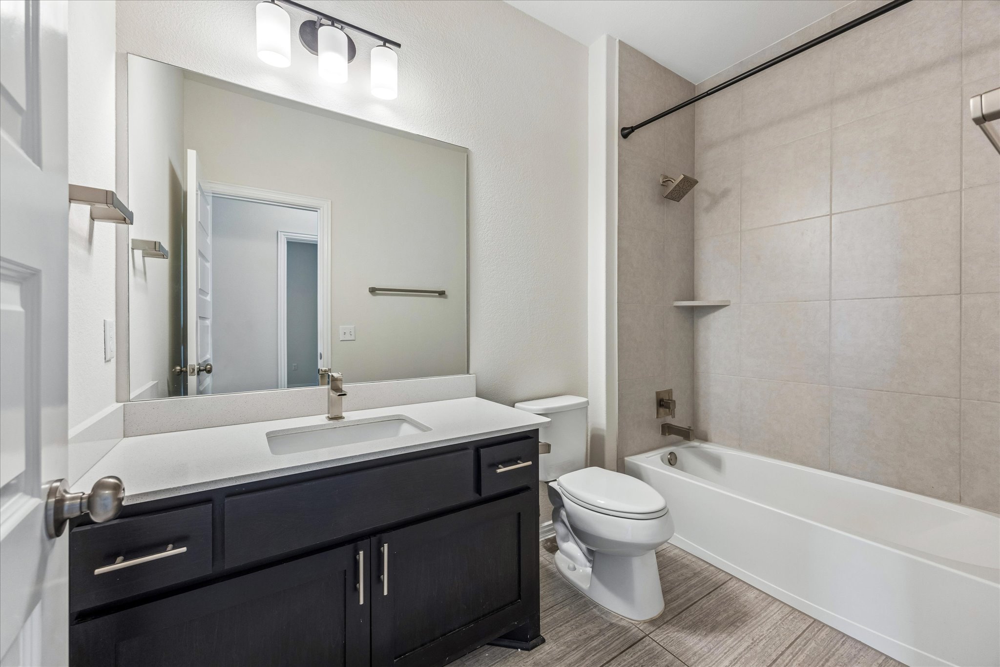 8816 Cattle Baron Path Austin, TX 78747 - Photo 24 of 32 a bathroom with a sink a toilet and a mirror