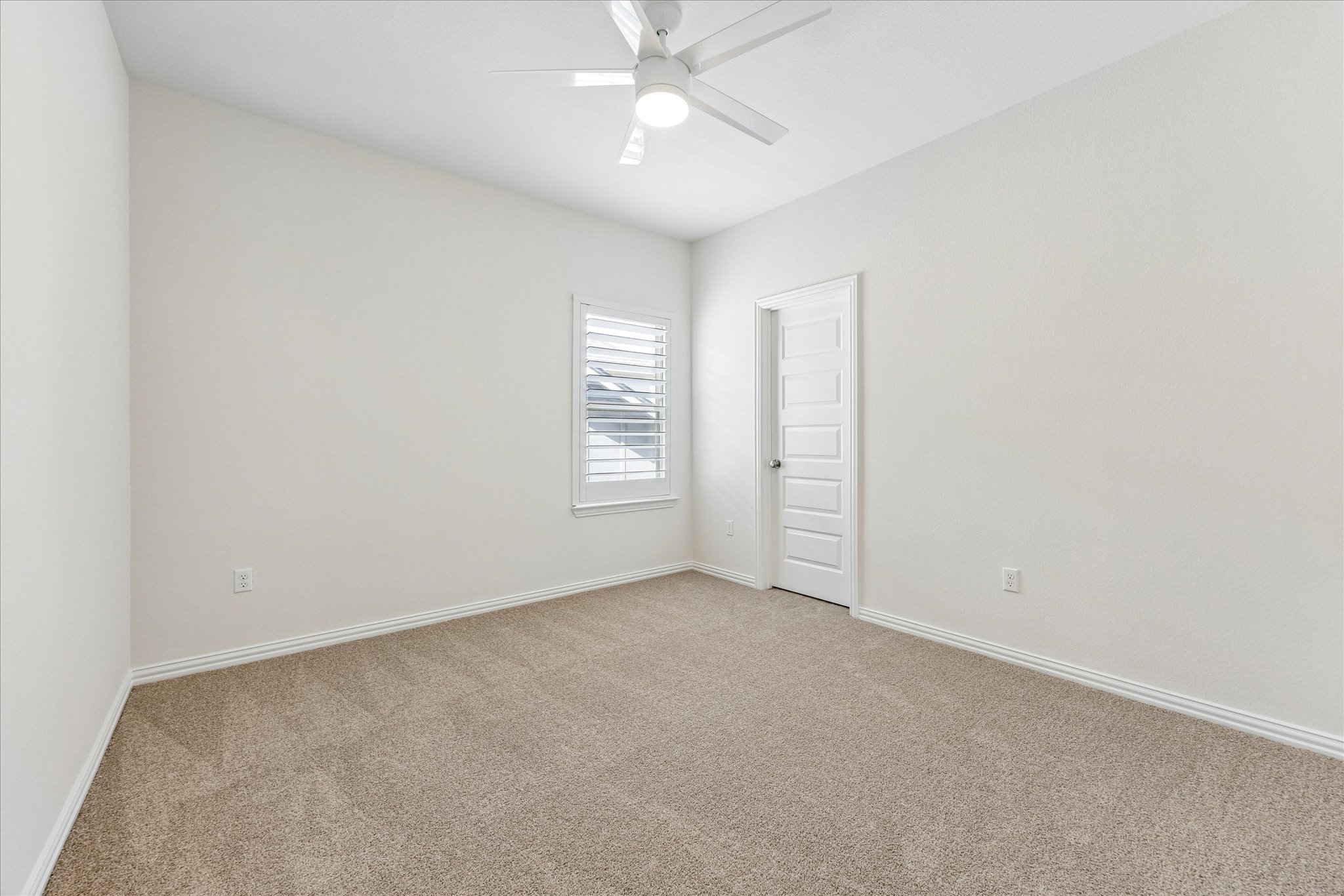 8816 Cattle Baron Path Austin, TX 78747 - Photo 25 of 32 an empty room with chandelier fan and windows