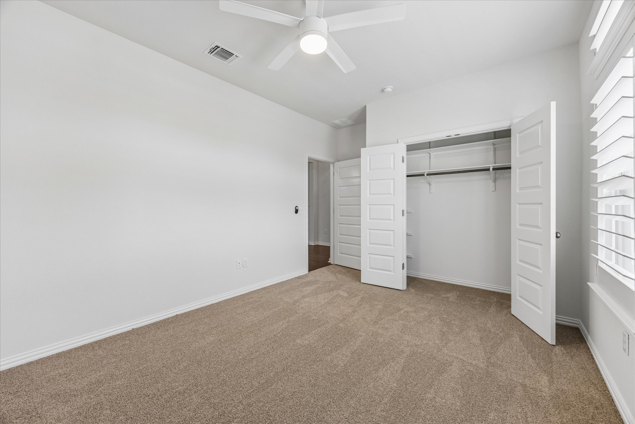 8816 Cattle Baron Path Austin, TX 78747 - Photo 28 of 32 an empty room with closet and windows