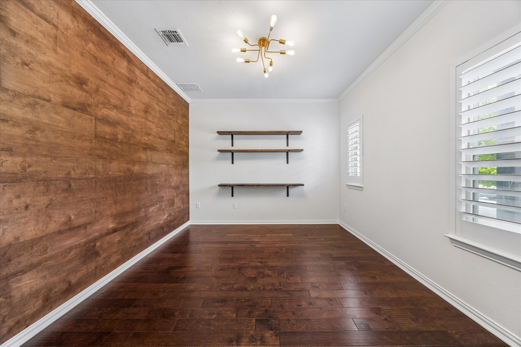 8816 Cattle Baron Path Austin, TX 78747 - Photo 6 of 32 a view of empty room with wooden floor and fan