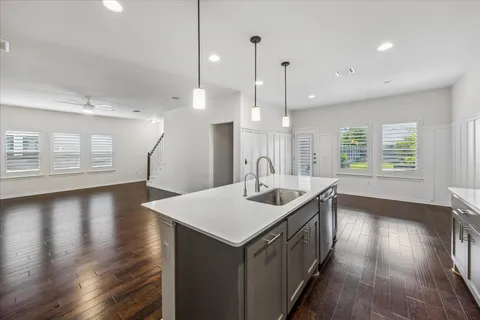 a kitchen with a sink and window